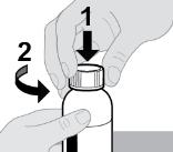 A close-up of a hand holding a bottle

Description automatically generated
